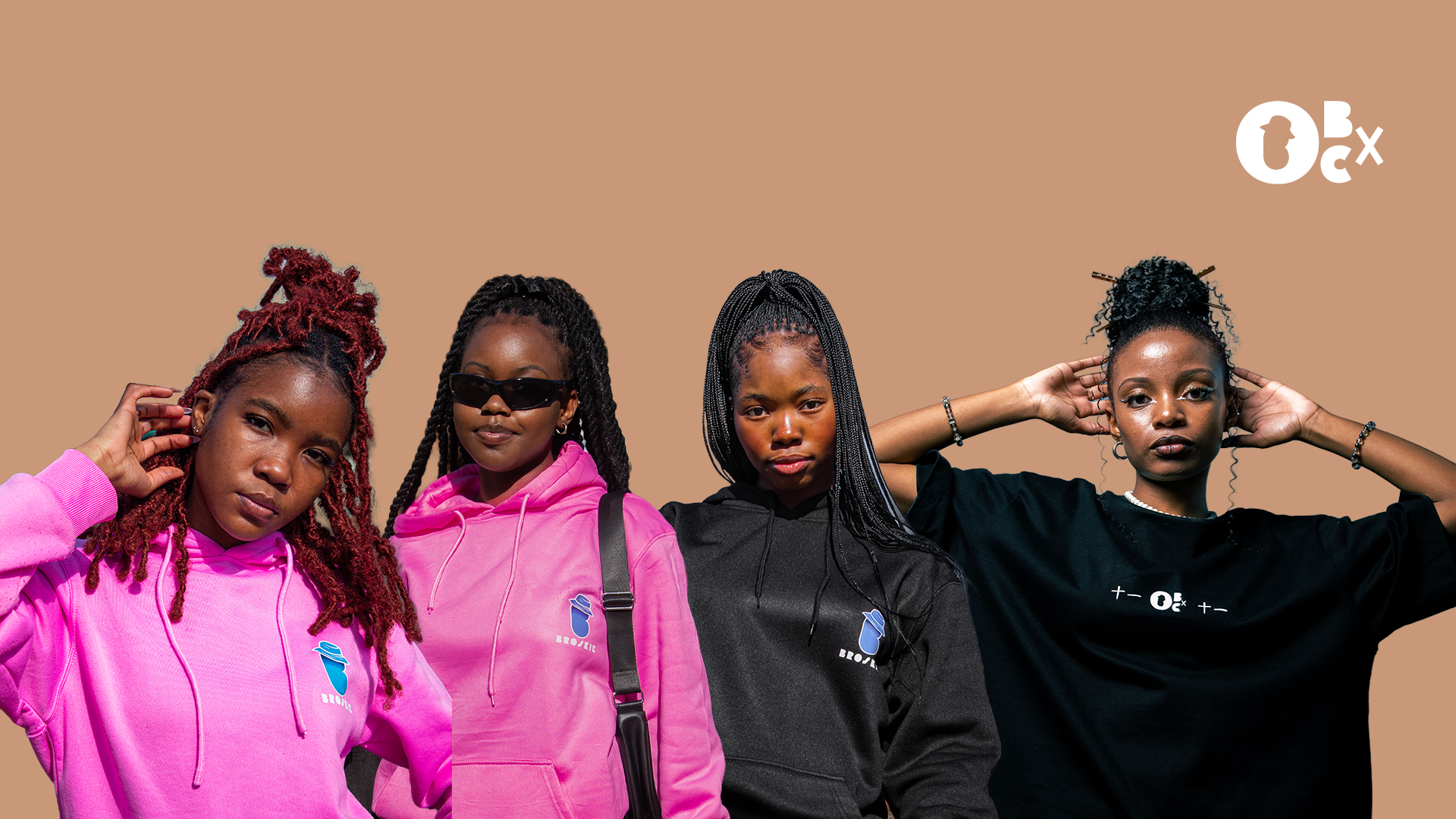 Four individuals wearing pink and black outfits against a beige background with a visible brand logo.